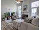 Bright living room features a fireplace, ceiling fan and large windows allowing for ample natural light at 2908 Cottesford Se Way, Smyrna, GA 30080