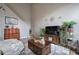 Living room with high ceilings, a large TV, a decorative rug, and staircase at 2908 Cottesford Se Way, Smyrna, GA 30080
