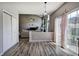 Open-concept living room features wood floors, a fireplace, and sliding glass doors to the backyard at 2908 Cottesford Se Way, Smyrna, GA 30080