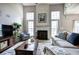 Bright living room with fireplace, high ceilings, decor, and view to seating area at 2908 Cottesford Se Way, Smyrna, GA 30080