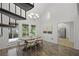 Dining room next to a spiral staircase with great natural light at 402 Roswell Green Ln, Roswell, GA 30075