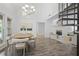 Dining room featuring an oval table and modern chandelier at 402 Roswell Green Ln, Roswell, GA 30075