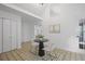 Cozy entryway with a round table, seating, neutral decor, and lots of natural light at 402 Roswell Green Ln, Roswell, GA 30075