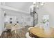 Spacious living room with vaulted ceiling, spiral staircase, and a cozy seating area at 402 Roswell Green Ln, Roswell, GA 30075