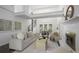 Open living space features hardwood floors, fireplace, and staircase to an upper level at 402 Roswell Green Ln, Roswell, GA 30075