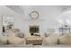 Comfortable living space with a fireplace, hardwood flooring, and ample seating at 402 Roswell Green Ln, Roswell, GA 30075