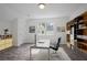 Bright home office with a large window, wood-look floors, and ample storage options at 402 Roswell Green Ln, Roswell, GA 30075