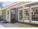 Covered patio with ceiling fan provides a comfortable outdoor living space at 402 Roswell Green Ln, Roswell, GA 30075