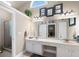 Bathroom boasts a double sink vanity with a walk-in shower at 530 Mount Park Dr, Powder Springs, GA 30127