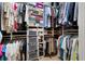 Walk-in closet with an array of shelves, hanging rods, and a ladder at 530 Mount Park Dr, Powder Springs, GA 30127