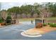 Gated entrance to a neighborhood with well-maintained landscaping and a secure entry point at 530 Mount Park Dr, Powder Springs, GA 30127