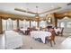 Spacious clubhouse event space with tables, chairs, and large windows at 530 Mount Park Dr, Powder Springs, GA 30127