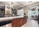 Kitchen with dark wood cabinets, granite countertops, and an eat-in bar at 530 Mount Park Dr, Powder Springs, GA 30127