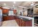 Elegant kitchen with granite countertops, stainless steel appliances, and tile flooring at 530 Mount Park Dr, Powder Springs, GA 30127