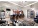 Open-concept living room with bar seating and seamless access to the kitchen at 530 Mount Park Dr, Powder Springs, GA 30127
