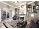 Inviting living space with open layout and fireplace with built-in shelving at 530 Mount Park Dr, Powder Springs, GA 30127