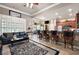 Bright living room with large windows, stylish furnishings and kitchen view at 530 Mount Park Dr, Powder Springs, GA 30127