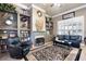 Comfortable living room with fireplace, built-in shelving, and stylish decor at 530 Mount Park Dr, Powder Springs, GA 30127