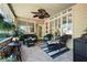 Well decorated patio with striped rug, fan, outdoor seating and view of backyard at 530 Mount Park Dr, Powder Springs, GA 30127