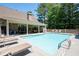 Outdoor pool with plenty of lounge chairs, perfect for relaxation and enjoying the summertime at 530 Mount Park Dr, Powder Springs, GA 30127
