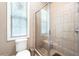 Updated tile shower featuring a glass enclosure and seat at 530 Mount Park Dr, Powder Springs, GA 30127