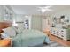 Light and airy bedroom with hardwood floors, walk-in closet, and calm, pale-green walls at 1412 Oakridge Cir, Decatur, GA 30033