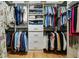 Organized walk-in closet with custom shelving, drawers, and ample hanging space at 1412 Oakridge Cir, Decatur, GA 30033