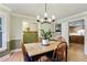 Charming dining room featuring hardwood floors and stylish lighting at 1412 Oakridge Cir, Decatur, GA 30033