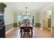 Bright dining room with hardwood floors and a view of the surrounding greenery at 1412 Oakridge Cir, Decatur, GA 30033