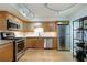 Modern kitchen with stainless steel appliances, granite countertops, and hardwood floors at 1412 Oakridge Cir, Decatur, GA 30033