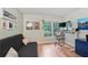 Bright office space with hardwood floors, a modern desk, and a comfortable futon at 1412 Oakridge Cir, Decatur, GA 30033