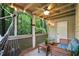 Inviting screened porch featuring comfortable seating, a hammock, and a view of the lush green surroundings at 1412 Oakridge Cir, Decatur, GA 30033