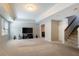 Finished basement featuring carpet flooring, a TV and stairs leading to upper floor at 6418 Crown Forest Ct, Mableton, GA 30126