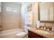 Well-maintained bathroom with tub, shower, granite countertop, and tile accents at 6418 Crown Forest Ct, Mableton, GA 30126