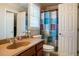 Bathroom featuring a large sink, toilet and decorative shower curtain at 6418 Crown Forest Ct, Mableton, GA 30126