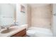 Bathroom features a large vanity with a tile backsplash and a bathtub with matching tile surround at 6418 Crown Forest Ct, Mableton, GA 30126