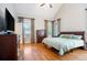Bright bedroom showcasing hardwood floors, a vaulted ceiling and natural light from the windows at 6418 Crown Forest Ct, Mableton, GA 30126