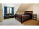 Cozy bedroom featuring a leather sofa, bed, and a table with shelves at 6418 Crown Forest Ct, Mableton, GA 30126