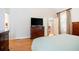 Bedroom featuring hardwood floors, and an entrance to an adjacent room at 6418 Crown Forest Ct, Mableton, GA 30126