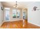Light-filled dining area with hardwood floors, window, and door at 6418 Crown Forest Ct, Mableton, GA 30126