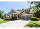 Spacious driveway and lush green lawn lead to this inviting home with a two-car garage at 6418 Crown Forest Ct, Mableton, GA 30126