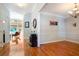 Inviting foyer with gleaming hardwood floors and elegant lighting fixtures at 6418 Crown Forest Ct, Mableton, GA 30126
