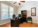 Functional home office with hardwood floors, natural light, and built-in shelving at 6418 Crown Forest Ct, Mableton, GA 30126