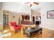 Open-concept living room flows into kitchen, showcasing hardwood floors and ample space at 6418 Crown Forest Ct, Mableton, GA 30126