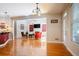 Spacious living room with hardwood floors, connecting to the kitchen and entry at 6418 Crown Forest Ct, Mableton, GA 30126