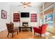 Bright living room boasts hardwood floors, built-in shelving, fireplace, and tall ceilings at 6418 Crown Forest Ct, Mableton, GA 30126