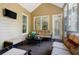 Inviting sunroom featuring neutral furniture and an abundance of natural light at 6418 Crown Forest Ct, Mableton, GA 30126