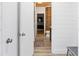 Bright bathroom showcases shiplap walls, wood-look tile flooring, and rustic wood accent wall at 87 Peachtree Sw St # 209, Atlanta, GA 30303