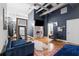 Open bedroom with a cozy sitting area, fireplace, and large windows for natural light at 87 Peachtree Sw St # 209, Atlanta, GA 30303