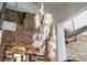 Stylish chandelier with unique design complementing the exposed brick in this renovated loft space at 87 Peachtree Sw St # 209, Atlanta, GA 30303